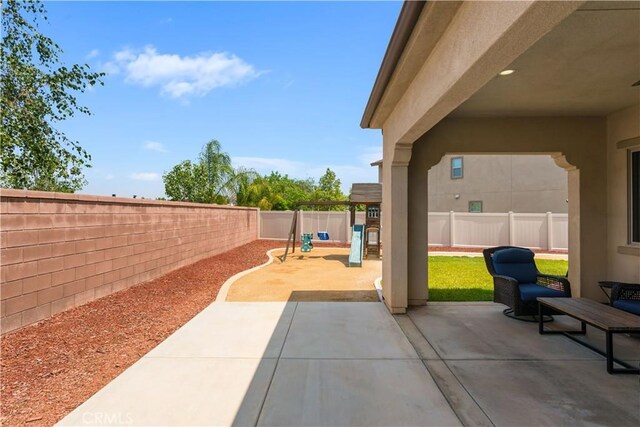 34901 Limecrest Pl, Murrieta, CA 92563 - fenced backyard featuring a playground and a patio