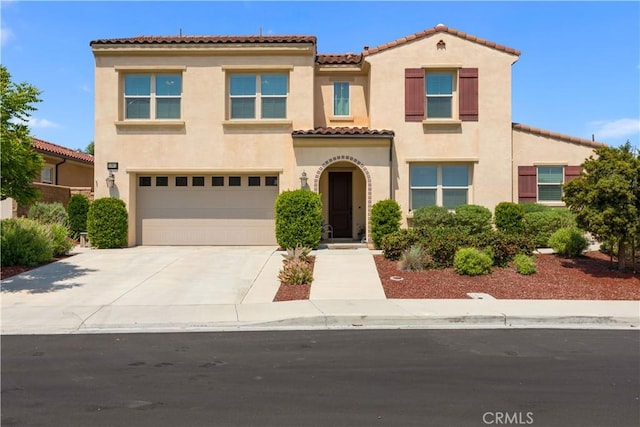 34901 Limecrest Pl, Murrieta, CA 92563 - mediterranean / spanish home featuring stucco siding, a tile roof, concrete driveway, and a garage