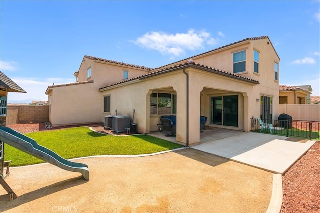 34901 Limecrest Pl, Murrieta, CA 92563 - back of house with stucco siding, a fenced backyard, a patio, and a tiled roof