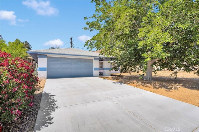 23870 Guajome Rd, Apple Valley, CA 92307 - view of front of property with concrete driveway, stucco siding, and a garage