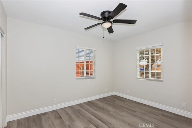 35010 Cedar Rd, Barstow, CA 92311 - unfurnished room with wood finished floors, baseboards, and ceiling fan
