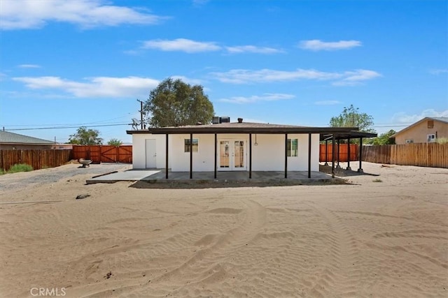 35010 Cedar Rd, Barstow, CA 92311 - rear view of property with french doors and a fenced backyard