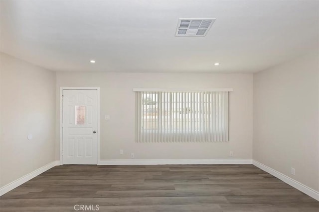 35010 Cedar Rd, Barstow, CA 92311 - spare room featuring wood finished floors, baseboards, and recessed lighting