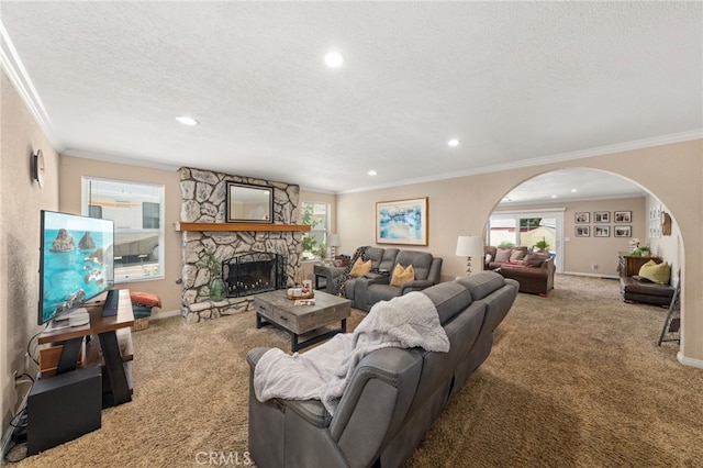 1938 N Quince Way, Upland, CA 91784 - living room with carpet floors, arched walkways, ornamental molding, recessed lighting, and a stone fireplace