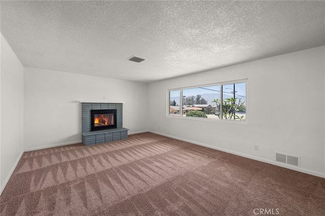 3221 W Jacinto View Rd, Banning, CA 92220 - unfurnished living room featuring a fireplace, carpet, a textured ceiling, and baseboards