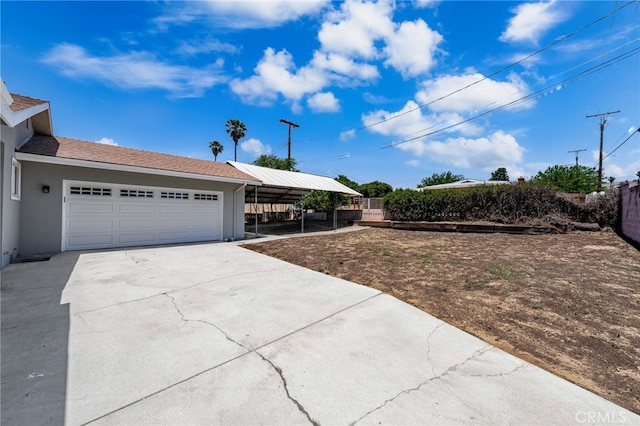 3221 W Jacinto View Rd, Banning, CA 92220 - view of front of house with concrete driveway, a garage, and stucco siding