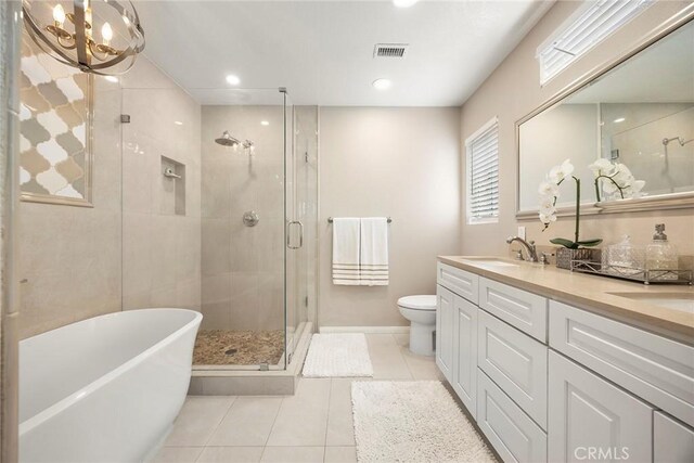 5020 Windy Cir, Yorba Linda, CA 92887 - full bathroom with tile patterned floors, a stall shower, a freestanding tub, double vanity, and a chandelier
