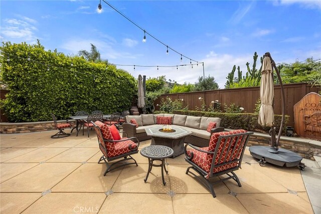 5020 Windy Cir, Yorba Linda, CA 92887 - fenced backyard featuring an outdoor living space with a fire pit and a patio area