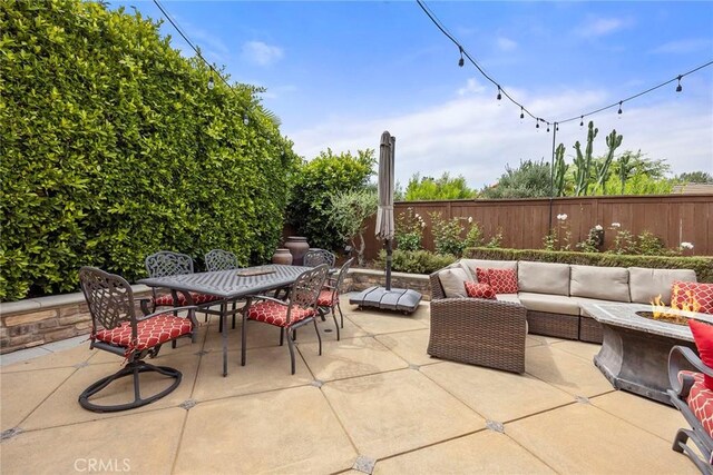 5020 Windy Cir, Yorba Linda, CA 92887 - fenced backyard featuring outdoor dining area, a patio area, and an outdoor living space with a fire pit
