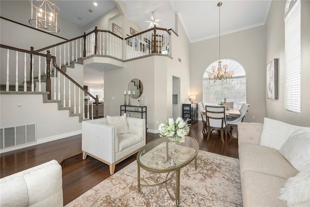 5020 Windy Cir, Yorba Linda, CA 92887 - living area with a chandelier, stairway, a towering ceiling, wood finished floors, and baseboards