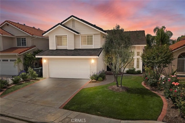 5020 Windy Cir, Yorba Linda, CA 92887 - traditional-style home featuring a garage, a front yard, driveway, and stucco siding