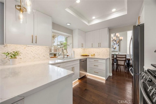5020 Windy Cir, Yorba Linda, CA 92887 - kitchen featuring appliances with stainless steel finishes, dark wood-style floors, white cabinets, light countertops, and a chandelier