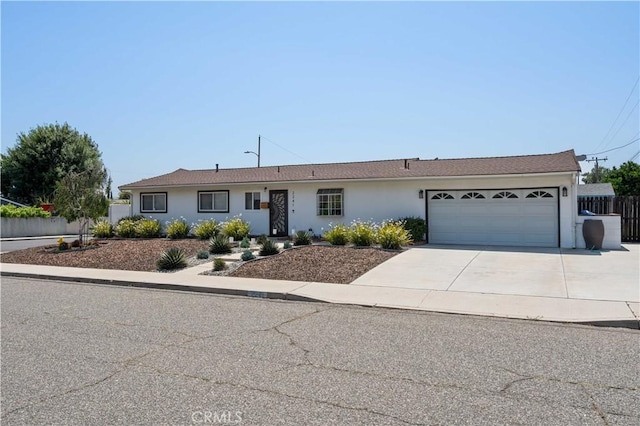 2241 Cordero Ave, Simi Valley, CA 93065 - ranch-style home with driveway, an attached garage, and stucco siding