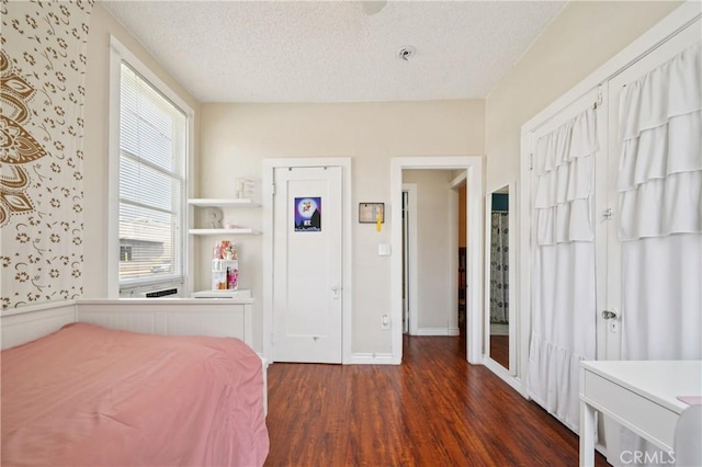 382 N Palomares St, Pomona, CA 91767 - bedroom featuring wood finished floors, a textured ceiling, and wallpapered walls