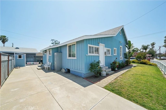 382 N Palomares St, Pomona, CA 91767 - view of front of house with board and batten siding, entry steps, a fenced backyard, a patio area, and a shingled roof