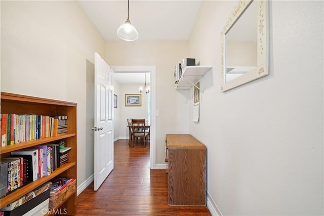 382 N Palomares St, Pomona, CA 91767 - hall featuring dark wood-style flooring and a chandelier