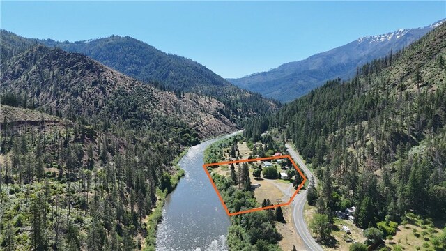 38727 State Highway 96, Klamath River, CA 96050 - view of mountain backdrop featuring a nearby body of water and a heavily wooded area