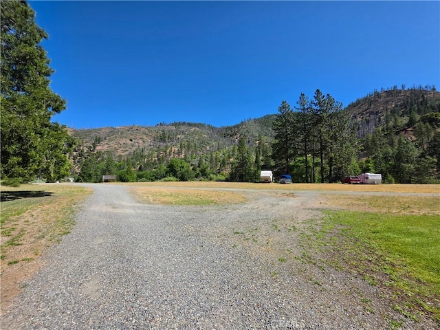 38727 State Highway 96, Klamath River, CA 96050 - view of dirt / gravel road featuring a mountain view and a wooded view