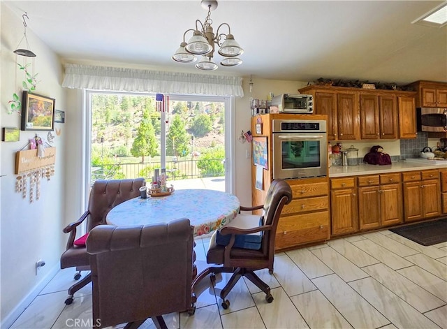 38727 State Highway 96, Klamath River, CA 96050 - dining area featuring a chandelier and healthy amount of natural light