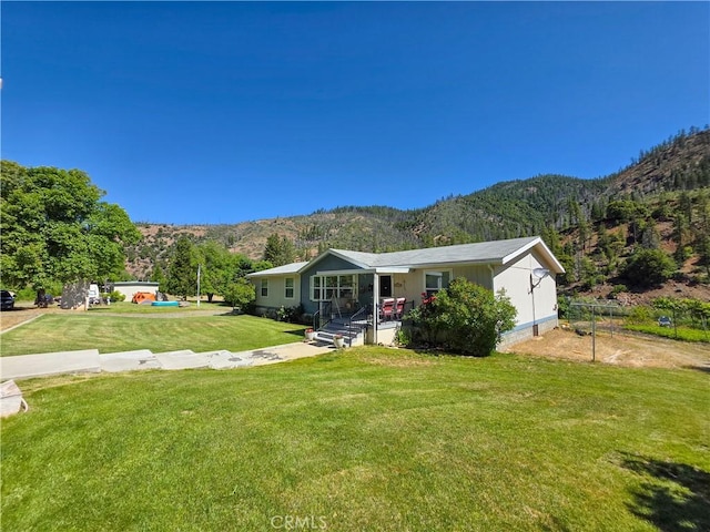 38727 State Highway 96, Klamath River, CA 96050 - ranch-style house with a mountain view, a front lawn, and a porch