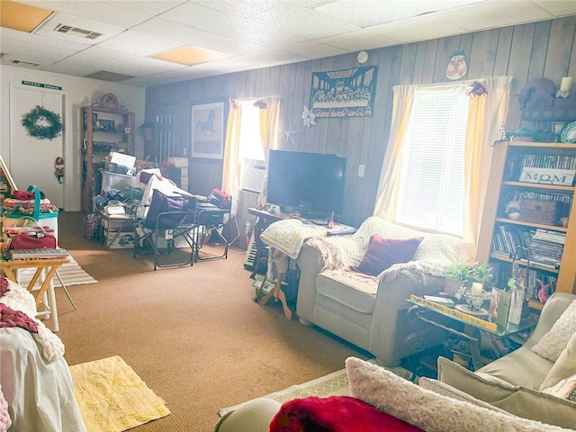 38727 State Highway 96, Klamath River, CA 96050 - carpeted living room featuring wood walls and a paneled ceiling