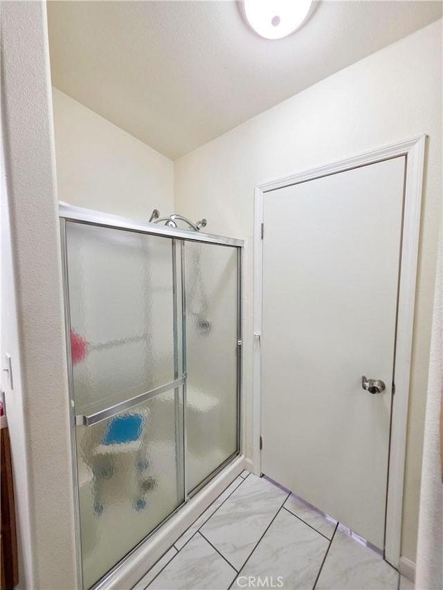 38727 State Highway 96, Klamath River, CA 96050 - bathroom with marble finish floors and shower / bath combination with glass door