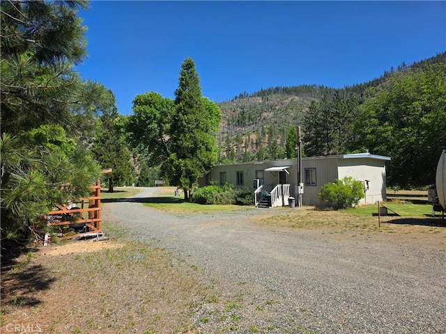38727 State Highway 96, Klamath River, CA 96050 - view of dirt / gravel driveway featuring a wooded view
