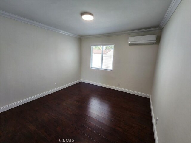 10450 Balboa Blvd, Granada Hills, CA 91344 - spare room with a wall mounted air conditioner, dark wood-type flooring, ornamental molding, and baseboards