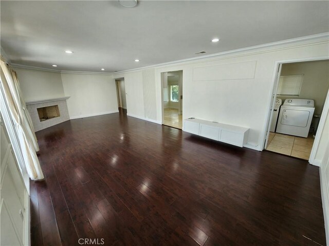 10450 Balboa Blvd, Granada Hills, CA 91344 - unfurnished living room with crown molding, hardwood / wood-style floors, washer and clothes dryer, a fireplace, and recessed lighting