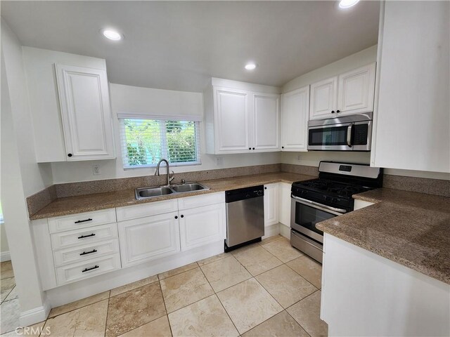 10450 Balboa Blvd, Granada Hills, CA 91344 - kitchen with appliances with stainless steel finishes, a sink, white cabinets, and recessed lighting