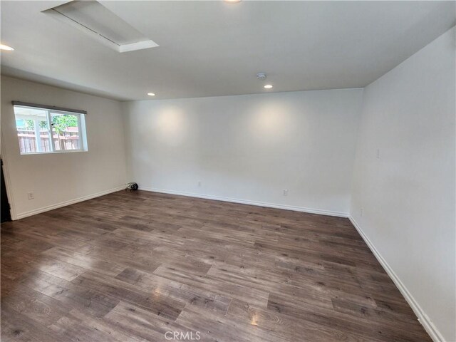 10450 Balboa Blvd, Granada Hills, CA 91344 - empty room featuring dark wood-type flooring, baseboards, and recessed lighting