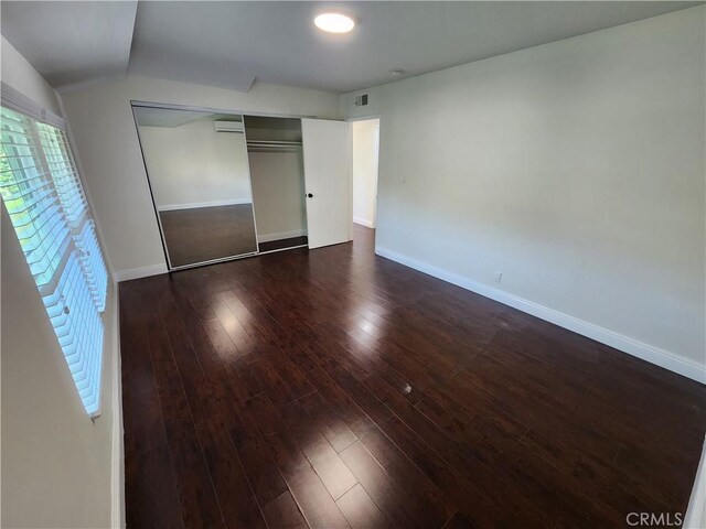 10450 Balboa Blvd, Granada Hills, CA 91344 - unfurnished bedroom featuring hardwood / wood-style flooring, a closet, baseboards, and vaulted ceiling