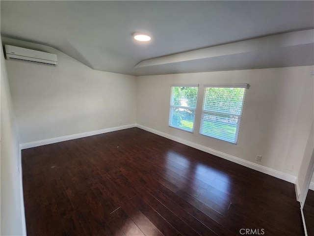 10450 Balboa Blvd, Granada Hills, CA 91344 - unfurnished room with a wall mounted AC, baseboards, dark wood-type flooring, lofted ceiling, and recessed lighting