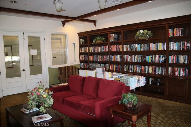 197 Inkster Way, Hemet, CA 92545 - living room with carpet floors, beamed ceiling, and bookshelves