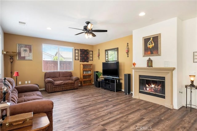 197 Inkster Way, Hemet, CA 92545 - living room with a ceiling fan, healthy amount of natural light, dark wood-style flooring, a glass covered fireplace, and recessed lighting