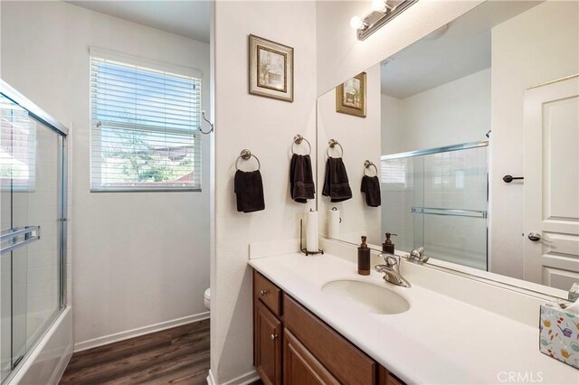 197 Inkster Way, Hemet, CA 92545 - full bath with vanity, wood finished floors, and enclosed tub / shower combo