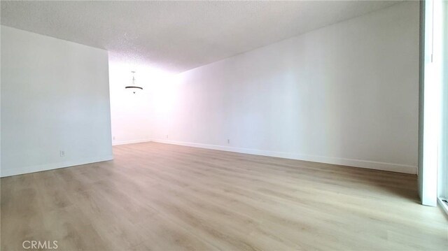 17070 Colima Rd Unit 284, Hacienda Heights, CA 91745 - spare room with light wood-style floors, a textured ceiling, and baseboards