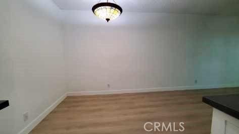 17070 Colima Rd Unit 284, Hacienda Heights, CA 91745 - unfurnished dining area featuring wood finished floors and baseboards