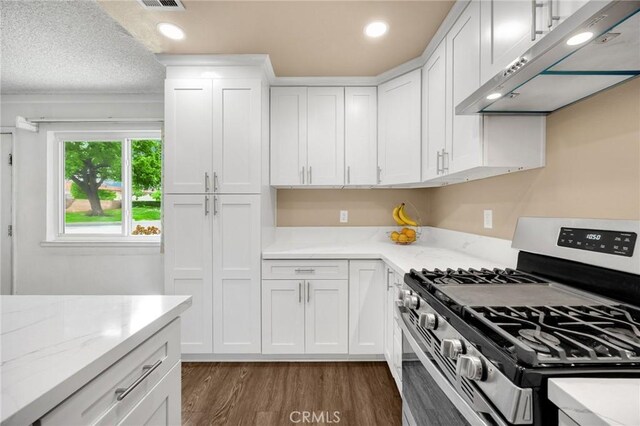 18241 Via Calma Unit 1, Rowland Heights, CA 91748 - kitchen featuring gas stove, exhaust hood, white cabinets, dark wood-type flooring, and recessed lighting