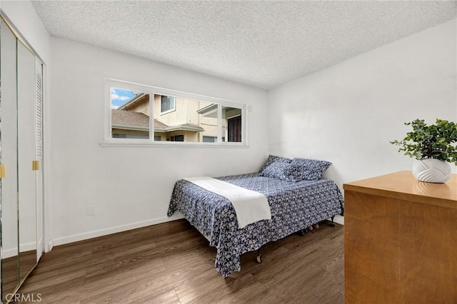 18241 Via Calma Unit 1, Rowland Heights, CA 91748 - bedroom with wood finished floors, a textured ceiling, and a closet