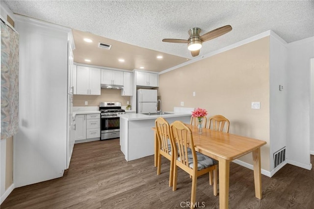 18241 Via Calma Unit 1, Rowland Heights, CA 91748 - dining space with dark wood finished floors, a textured ceiling, ornamental molding, ceiling fan, and recessed lighting