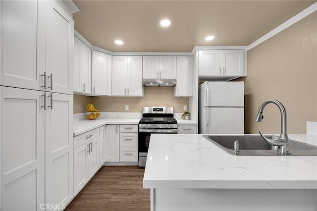 18241 Via Calma Unit 1, Rowland Heights, CA 91748 - kitchen featuring freestanding refrigerator, stainless steel range with gas cooktop, under cabinet range hood, white cabinets, and recessed lighting