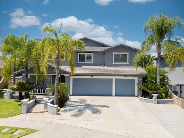 1555 Lupine Cir, Corona, CA 92881 - view of front of home featuring a garage, concrete driveway, stucco siding, and a tile roof