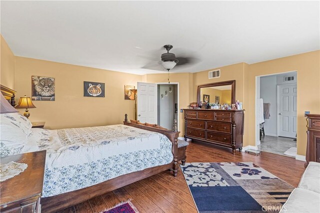 1555 Lupine Cir, Corona, CA 92881 - bedroom with wood finished floors, a ceiling fan, and baseboards