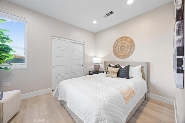 225 Waypoint, Tustin, CA 92782 - bedroom with light wood-type flooring, baseboards, recessed lighting, and a closet