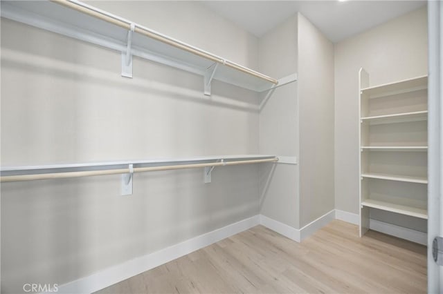 225 Waypoint, Tustin, CA 92782 - walk in closet with wood finished floors