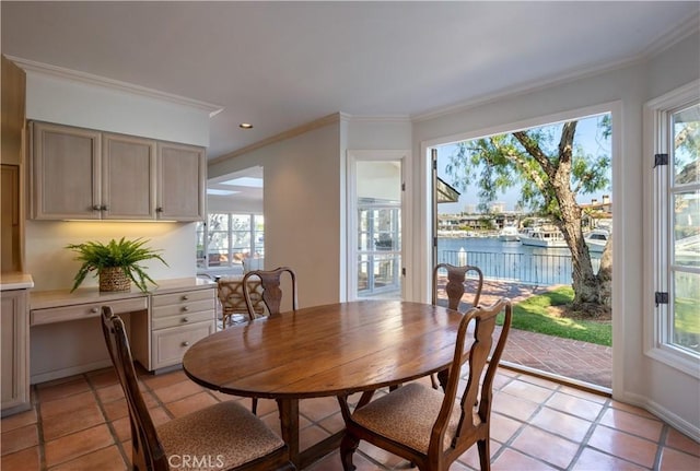 1100 Polaris Dr, Newport Beach, CA 92660 - dining space with a water view, crown molding, light tile patterned floors, and recessed lighting