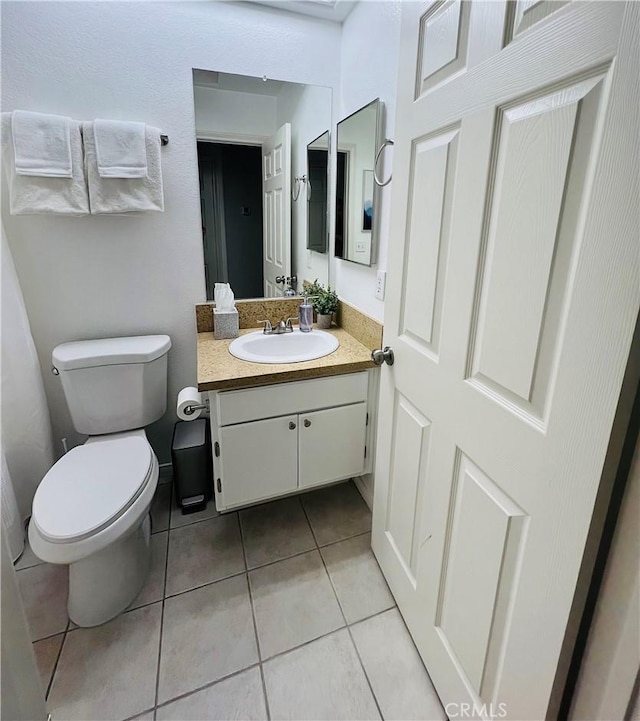 12390 San Dimas St, Victorville, CA 92392 - bathroom featuring vanity, toilet, and tile patterned floors