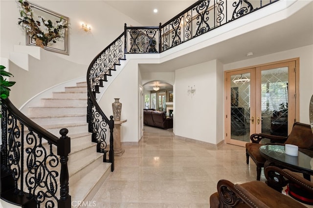 950 Chantel Dr, Corona, CA 92879 - entrance foyer featuring french doors, a towering ceiling, plenty of natural light, arched walkways, and stairs