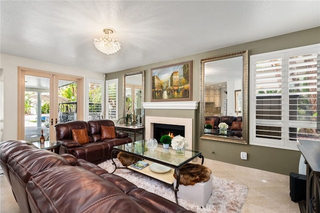 950 Chantel Dr, Corona, CA 92879 - living room featuring a warm lit fireplace, a chandelier, and french doors